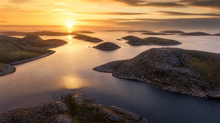 Aerial still: a rocky archipelago at sunset